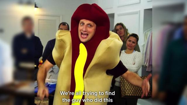 A man in a hotdog costume says 