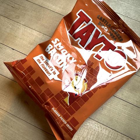 A bag of Tayto crisps, smoky bacon flavour. 