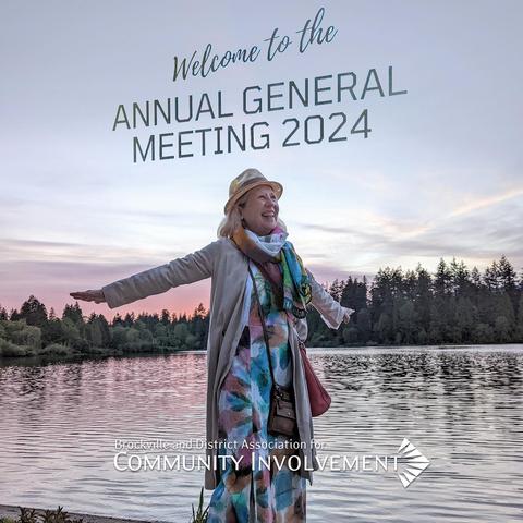 Franke James at Lost Lagoon in Vancouver raises her arms like she is about to take-off. She is wearing the same long, pastel dress as at the BDACI AGM and the type saying, 