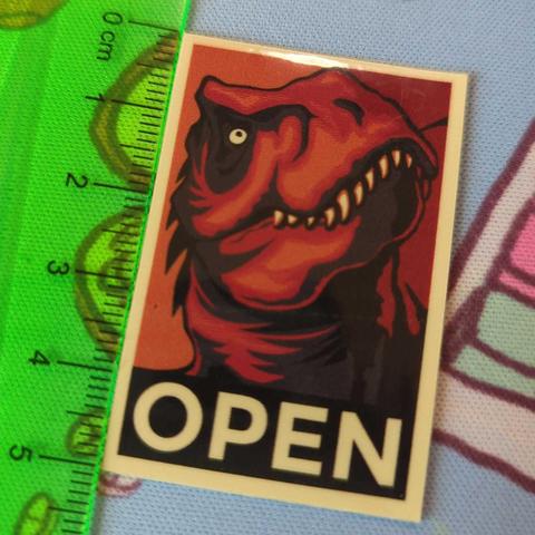 An old-school dinosaur Mozilla sticker.