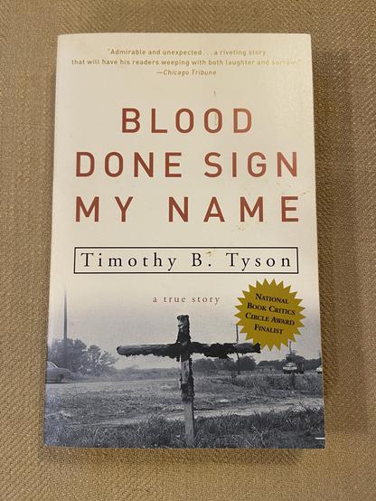 Photograph of my paperback copy of the book “Blood done sign my name” by Timothy Tyson