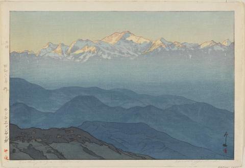 Print of snow covered mountains with sunlight on them. In the mid and foreground are fog covered and darker peaks and hills lower thar the vantage point