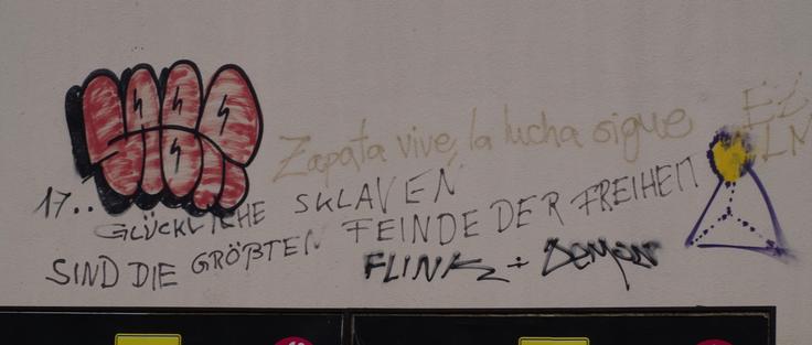 Graffito: Glückliche Sklaven sind die größten Feinde der Freiheit!