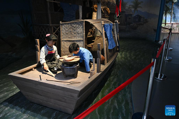 This photo taken on July 26, 2024 shows an installation depicting a houseboat where Danjia people live at Hainan Tanka Museum in Lingshui, south China's Hainan Province