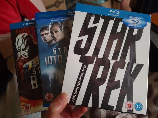 Photo. Blu-ray editions of the three Kelvin-universe Star Trek films. 