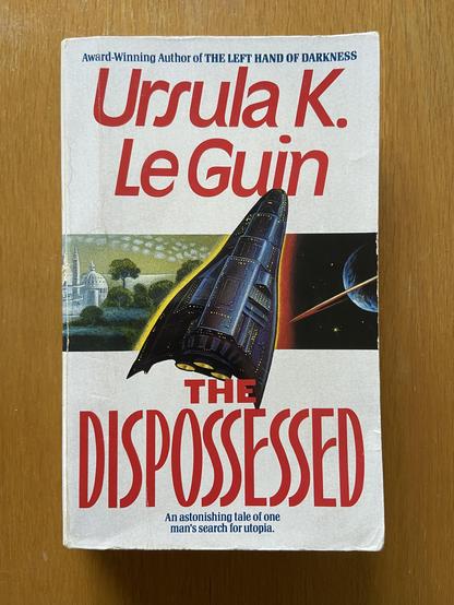 Photograph of my paperback copy of the book “The dispossessed” by Ursula LeGuin