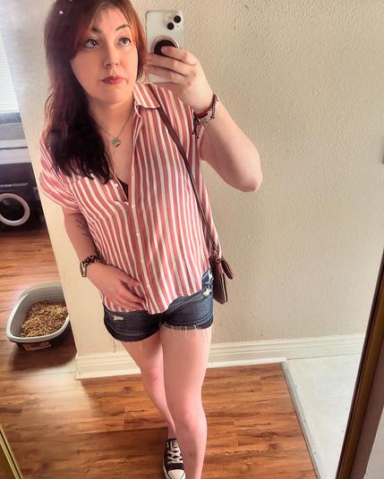 A selfie of me wearing a red striped shirt and denim shorts with converse and wearing a brown purse