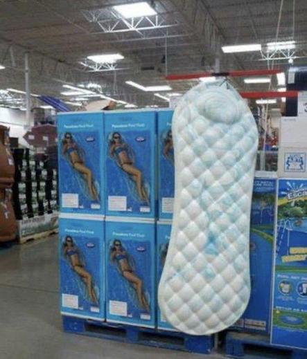 display of boxes of pool bed floats, with what looks like a giant sanitary pad with built-in pillow