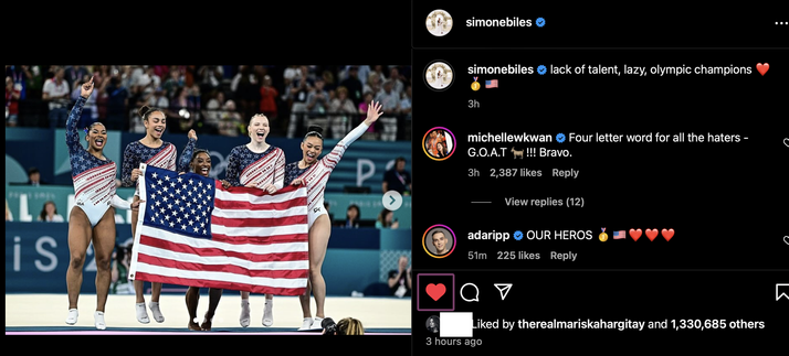 screenshot of Simone Biles’ Instagram post, captioned “lack of talent, lazy, olympic champions ❤️🥇🇺🇸” and it’s a photo of the whole team celebrating with the USA flag. Comments underneath include Michelle Kwan “Four letter word for all the haters - G.O.A.T 🐐 !!! Bravo.” 