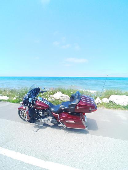 our 2017 Harley Ultra Limited stopped along the Lake Huron shoreline somewhere near Kilcincade, Ontario, Canada. stunning blue water to the horizon.