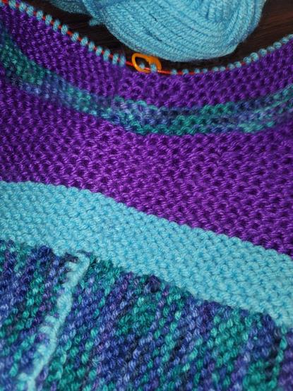 Knitting in purples wnd blues