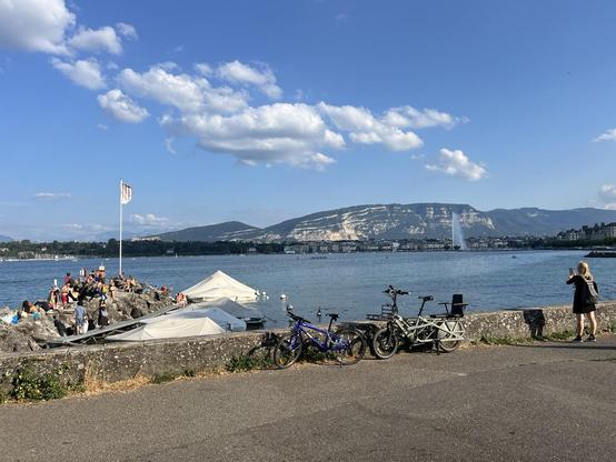 View across Lake Geneva towards the jet fountain. Blue skies above.