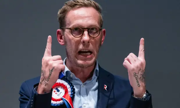 Laurence Fox, from a Sky News article. He points multiple fingers upwards and I assume is talking random shit about the climate actually being a foreign vaccine carrying lesbian paedophile.  