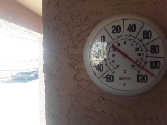 Thermometer in the shade on my balcony showing a temperature of 110 degrees Fahrenheit at 11:10 am, Sunday, August 3, 2024