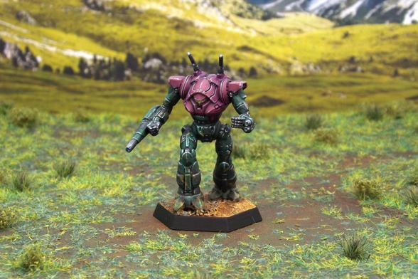 A painted miniature of a Wraith 'Mech.  Its upper body is purple, and its limbs are dark green camo.  It has no emblems or other markings.  The miniature is photographed on grassy terrain.
