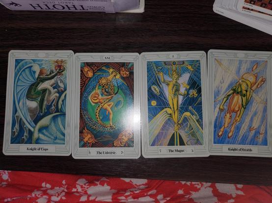 Four cards as they appeared, L to R: Knight of Cups, The Universe, The Magus (aka The Magician), Knight of Swords
