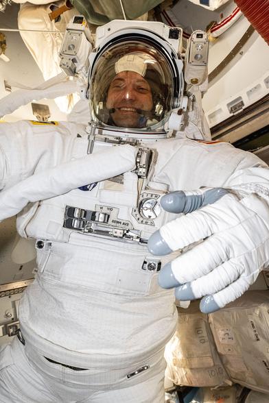 NASA_astronaut_Matthew_Dominick_evaluates_a_spacesuit_(iss071e414633).jpg