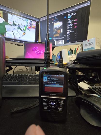 Picture of Icom ID-52A in front of a 3 monitor laptop setup.