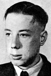 Headshot photo of Jan van Hoof in three quarter view looking to the left.  He is wearing a white shirt, tie, and jacket. 