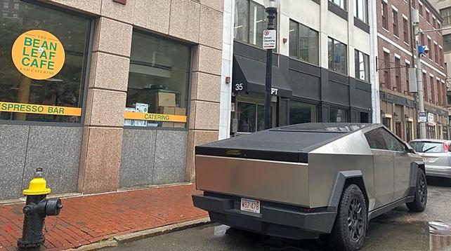 Cybertruck with commercial plates taking up two spaces in downtown Boston