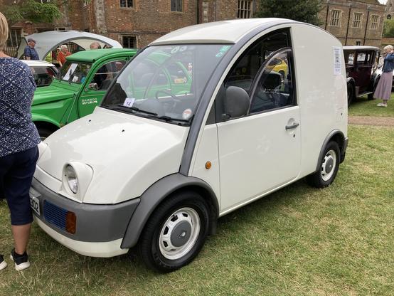 White Nissan S-Cargo, front/side view