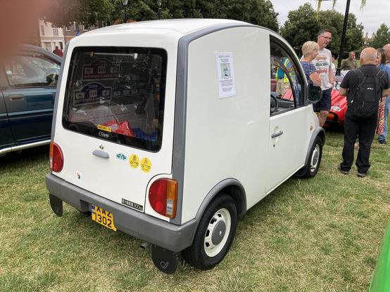 White Nissan S-Cargo, rear quarter view