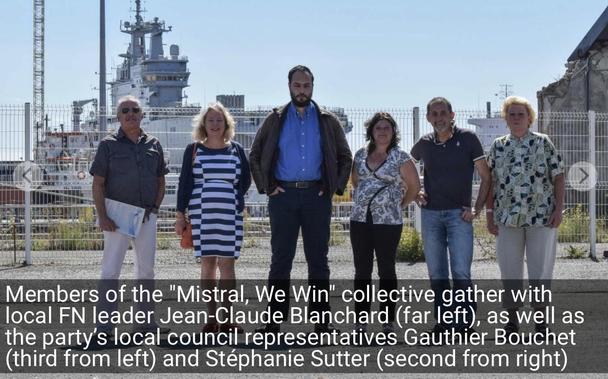 Photo of a local Front National politicians with the first ship in the background. Not in the shot are about 400 Russians who were there to take delivery of the ship a couple weeks later.