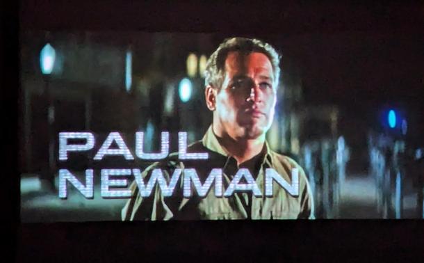 Opening of movie with a scene at night with a shot of Paul Newman and his name in block letters