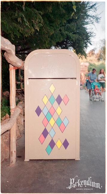 Peach trash can with multicolored diamond pattern 