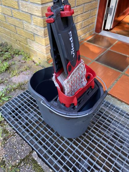 The mop and bucket. Ferrari red with faded-bicycle-tire black. Decent quality.