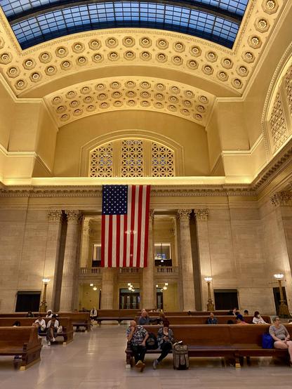 Union Station has a large hall with seating for a handful of people and shit acoustics. It's not a place you want to be: as shown by it mostly being empty.

There's the courtesy big US flag to remind Americans they're not, in fact, in Venezuela.