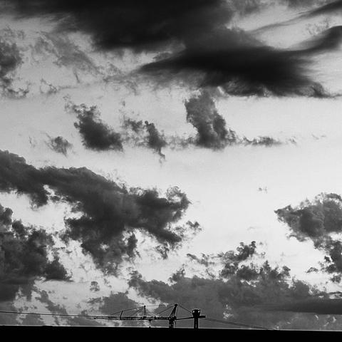 This is a photo of some Angry Clouds moments before a Thunderstorm.
The photo is in black and white