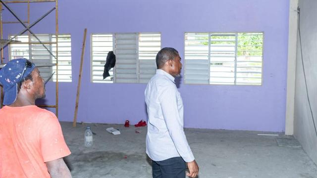 PM Drew looking on at work being done at the Cayon High School.jpg