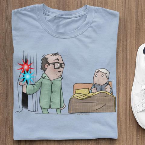 A light blue T-shirt with a HappyToast illustration of Morecambe & Wise, and the sketch where a fire engine drives by and Eric says 