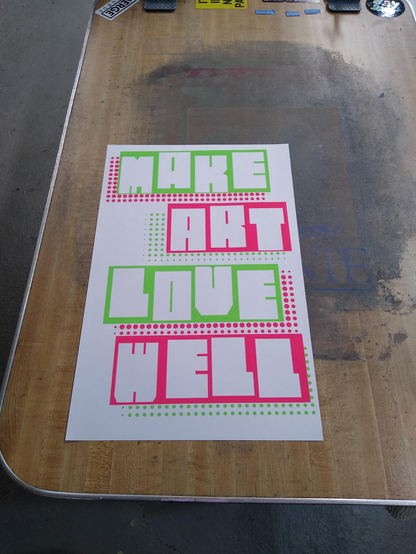 An 11x17 screenprinted poster that reads, in large, extremely blocky letters: 