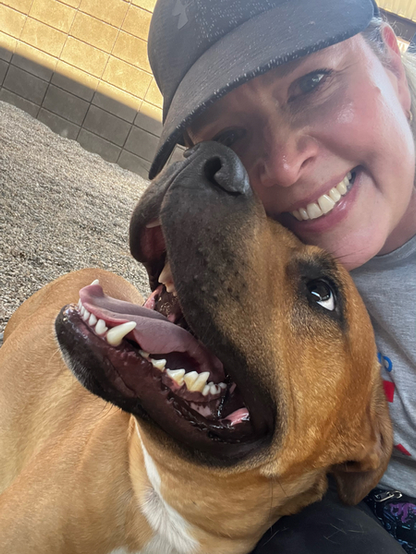 Beautiful dog and a person smiling for the camera.

Caption: 