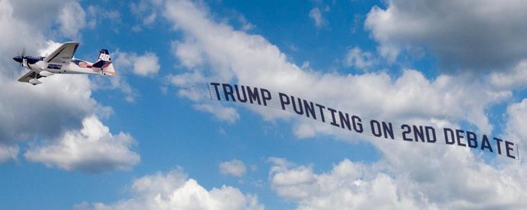 Plane flying banner Trump’s Punting on 2nd Debate