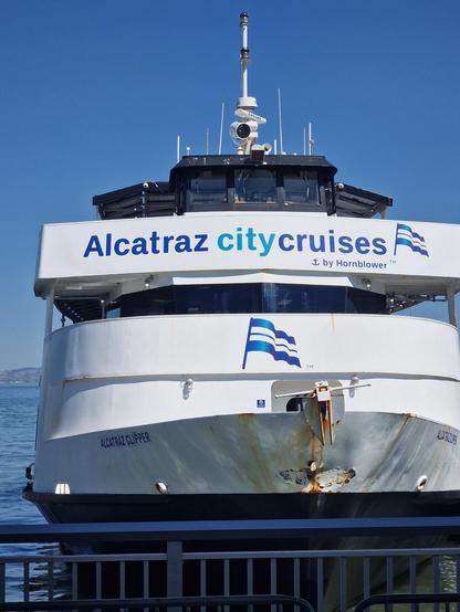 Photo of the bow of a large boat which says Alcatraz City Cruises by Hornblower