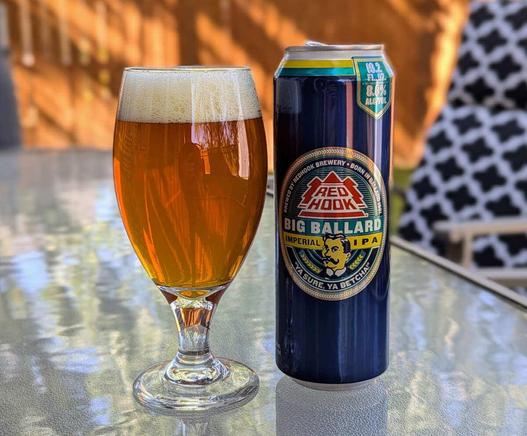 A glass of Big Ballard Imperial IPA from Redhook Brewery. It's a classic old-school imperial IPA with a near-retro can design.