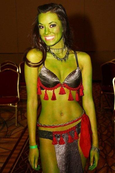 Joani Brosas (possibly?) cosplaying as a Star Trek character, painted green and wearing a bikini. 