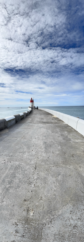 Vertical panorama of a red lighthouse in the port.south west of France 