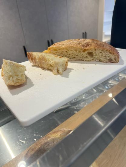 The potato bread! It’s got a bubbly looking inner and crusty outer. The bread was originally round but this one has been cut up. 