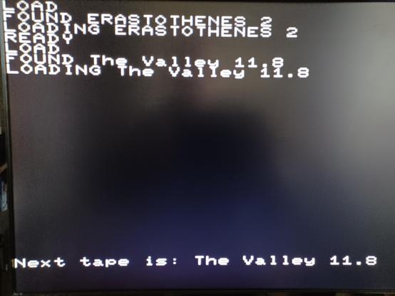 Emulator screen showing the next available tape to load is The Valley 11.8.