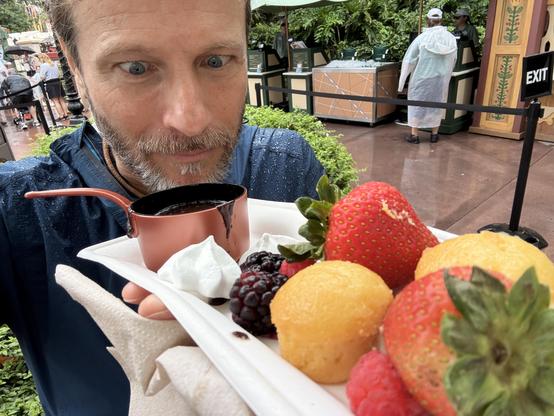 A tray of fruit, treats, and a tiny pot of chocolate fondue. I look at it with wide eyes.