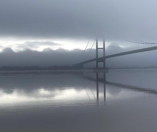 One misty moisty morning when cloudy was the weather
I met with an old man carrying a camera (me) 😃
This is a photo of Humber Bridge in Yorkshire on a foggy and cold morning.
The photo looks almost mono but is in colour. Only one part of the bridge is visible 