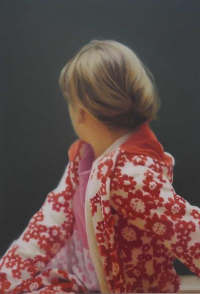 gerhard richter’s photorealistic painting “betty,” featuring a blond woman with hair pulled back turned away from the perspective of the viewer, looking over her right shoulder, with her left shoulder towards us. she’s wearing a red & white, floral print jacket.