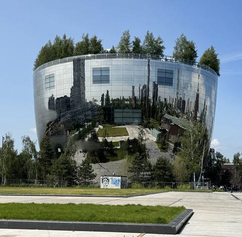 Building that reflects its surroundings it its mirror cladding. 