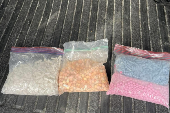 Three Ziploc bags each containing many colored pills 💊 