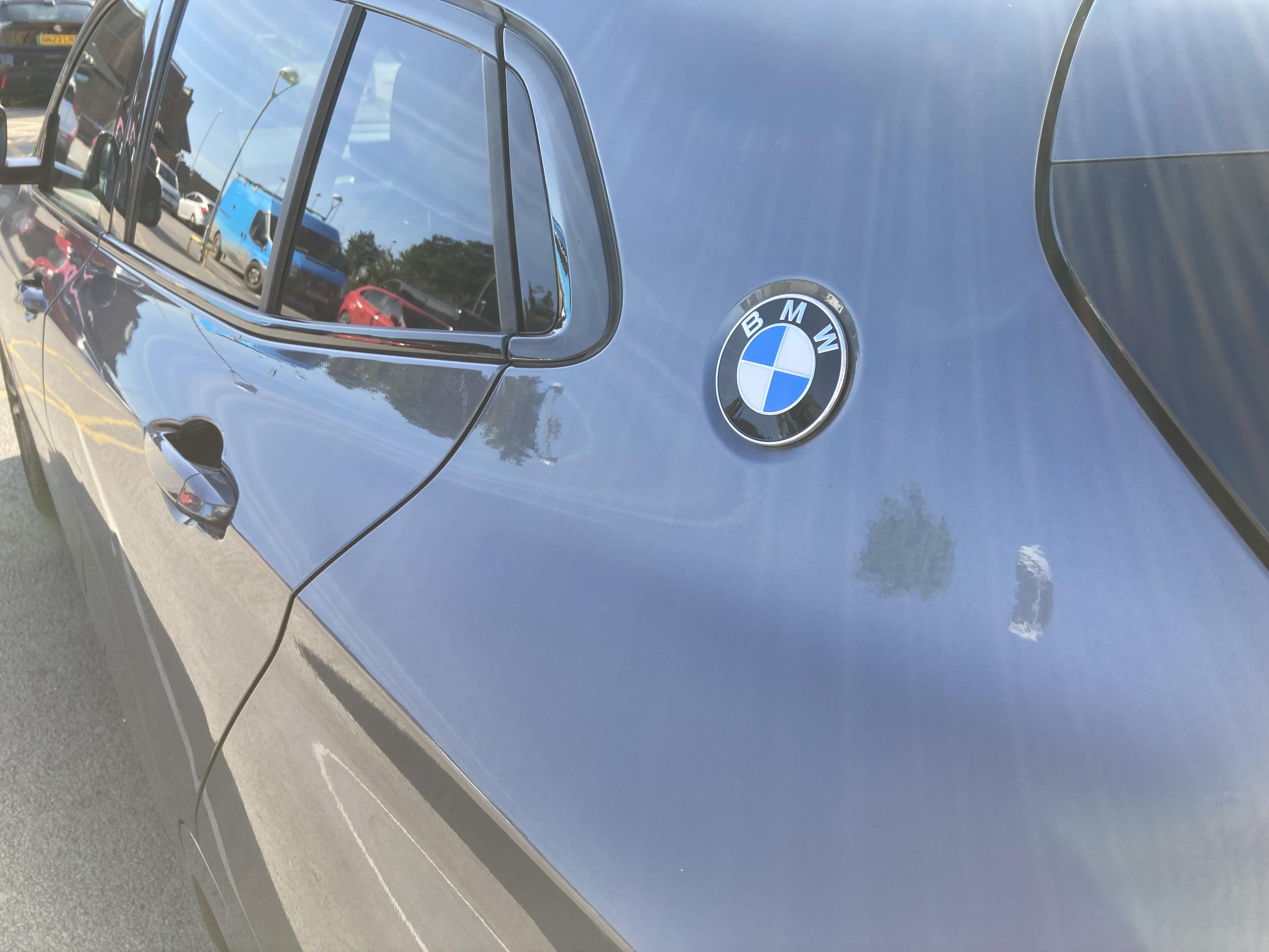 Grey metallic BMW X2 - rear pillar badge detail
