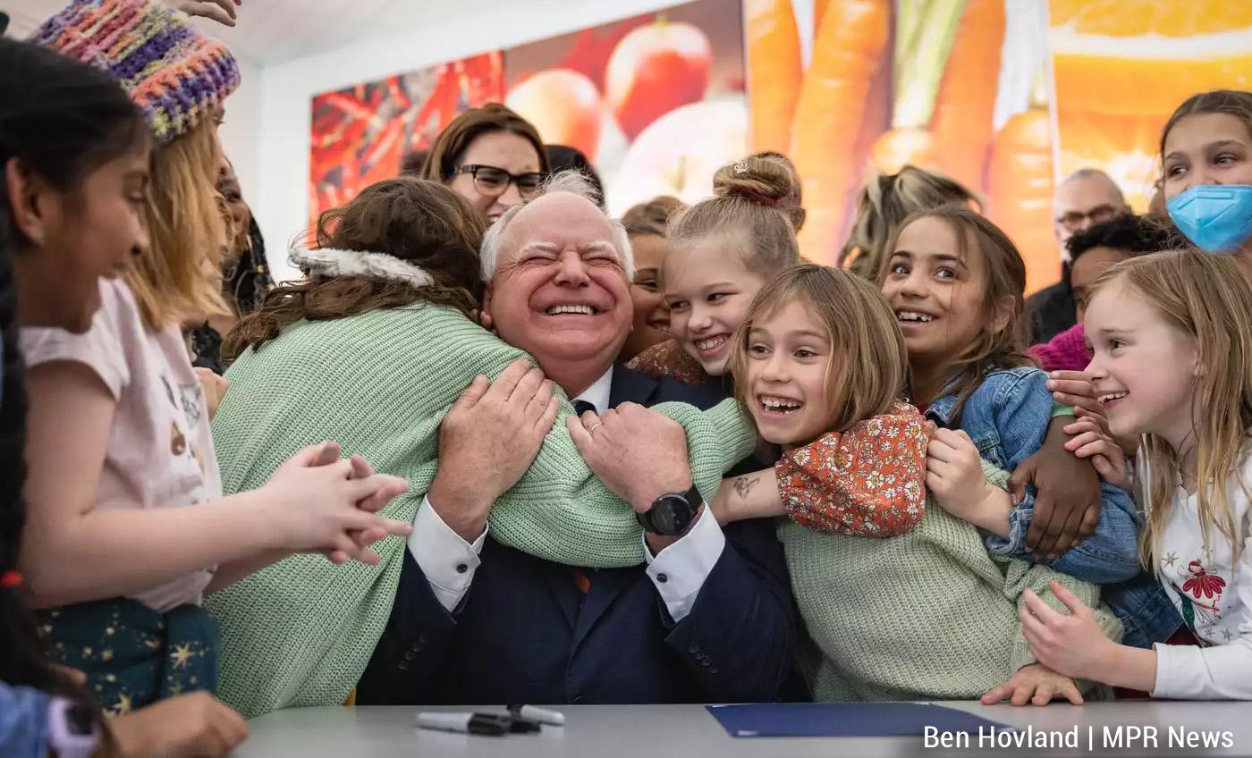 Governor Tim Walz surrounded by smiling kids hugging him after signing the bill to feed school kids in #Minnesota.
Photo by Ben Hobeland MPR News.
